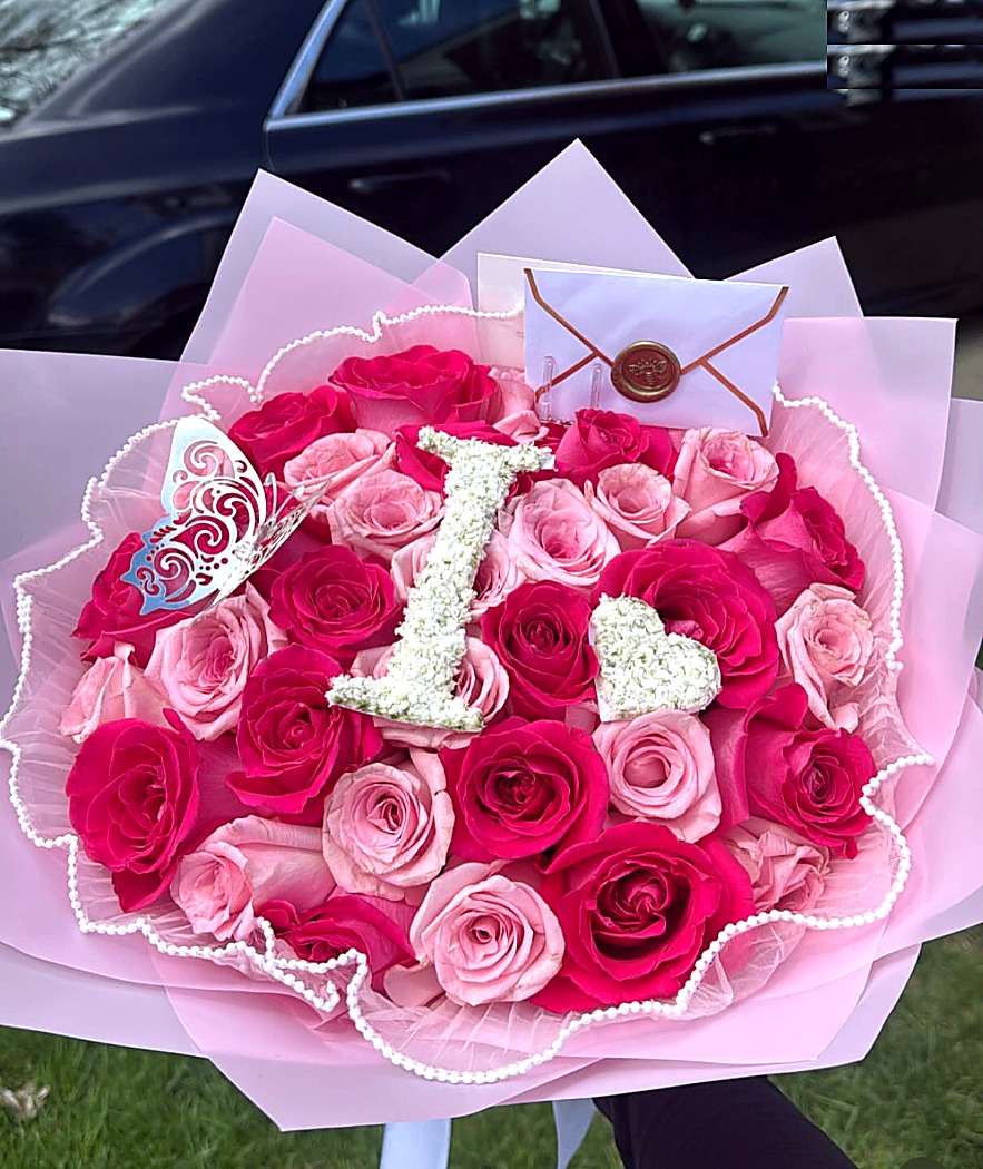 Pink custom floral initial bouquet by Ayani Floral